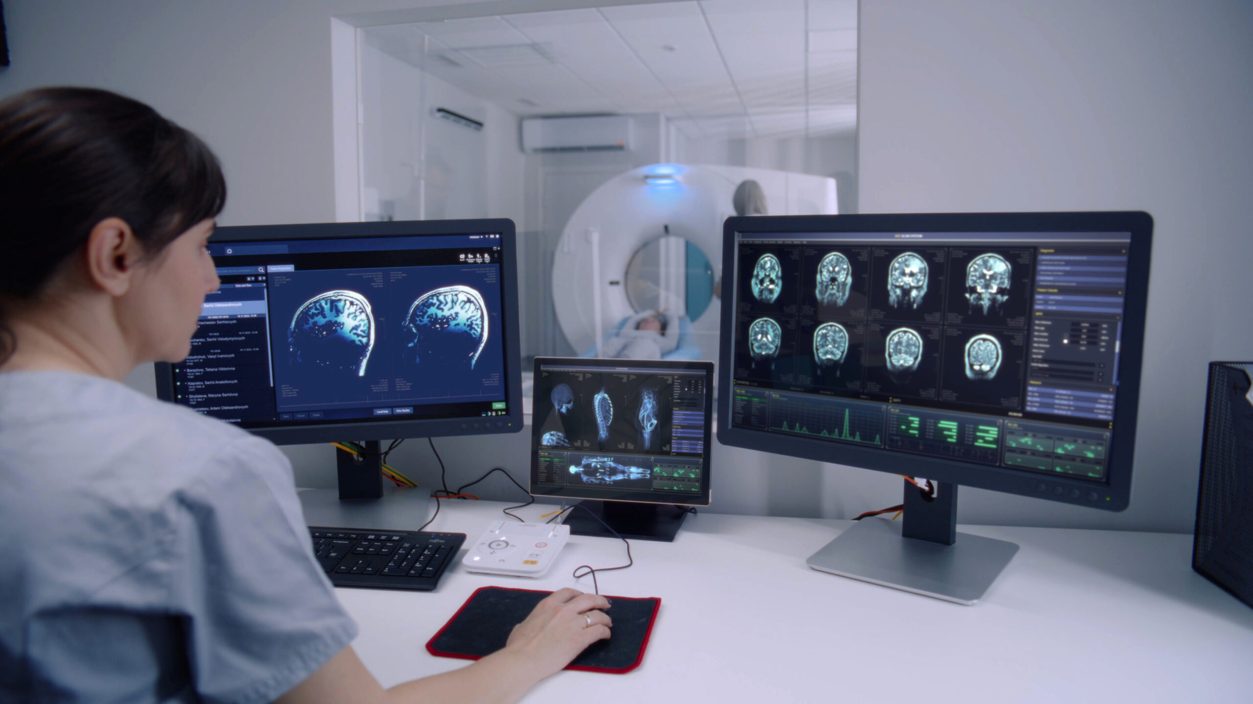 Female Radiologist Monitors Scans